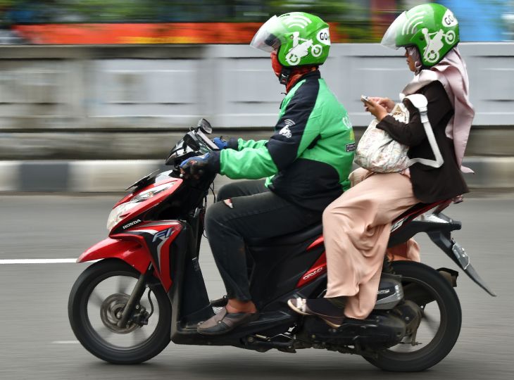 Grab moto driver and passenger