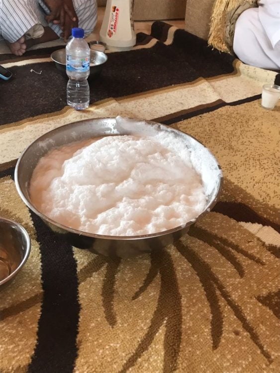 Frothing camels milk.